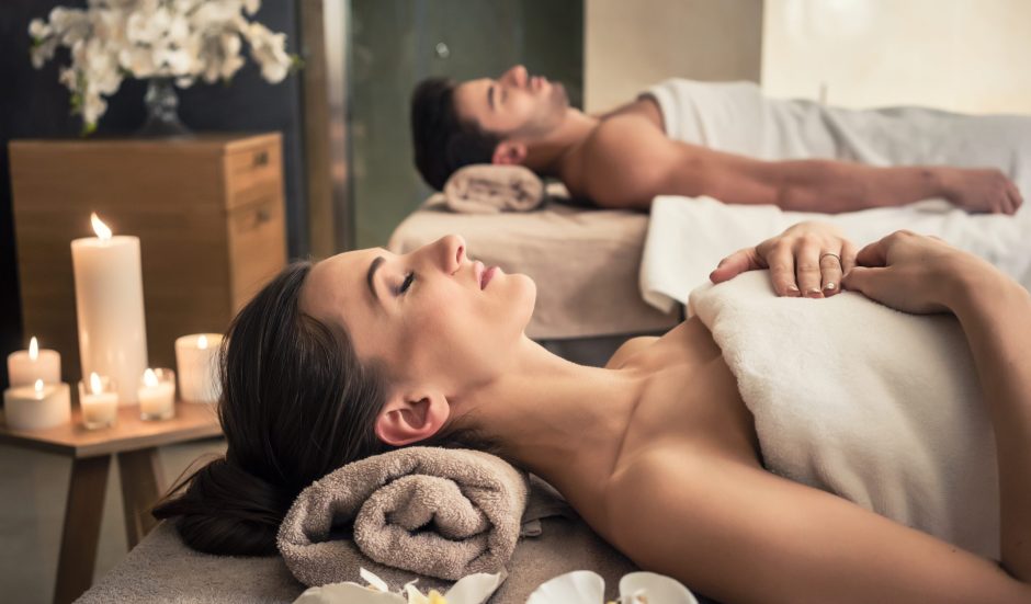 Young,Man,And,Woman,Lying,Down,On,Massage,Beds,At Young,Man,And,Woman,Lying,Down,On,Massage,Beds,At